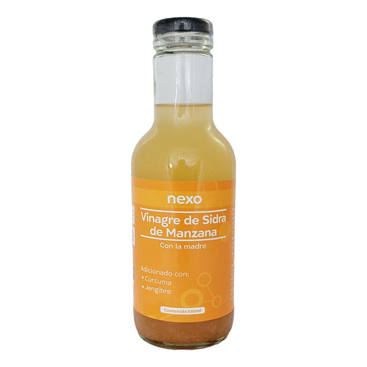 Vinagre de sidra de la manzana con la madre cúrcuma y jengibre.